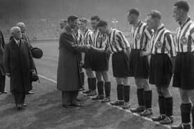 The big moment in the pre match preliminaries as Raich Carter presents his players to King George VI. 