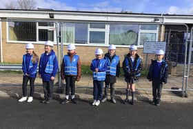 Children from St John Bosco Primary School check in on the remediation work taking place.