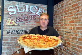 Reporter Neil Fatkin takes on the 24 inch pizza challenge.