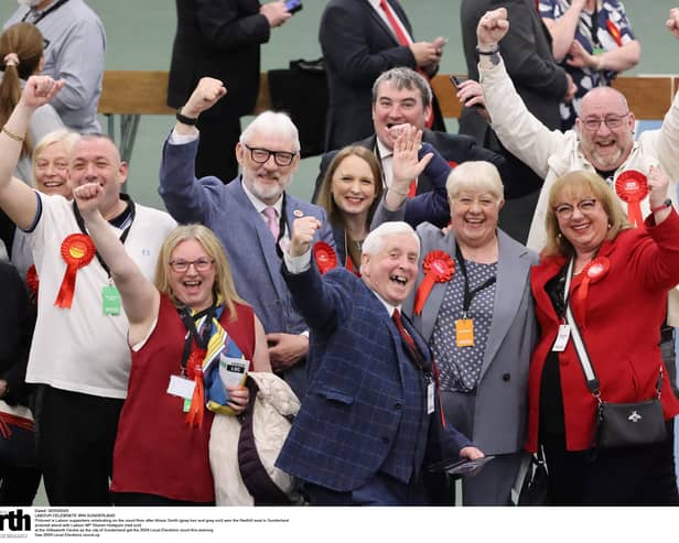 Labour supporters celebrating on the count floor after Alison Smith (grey suit, red rosette and orange tag) won the Redhill seat in Sunderland, pictured along with Labour MP Sharon Hodgson (red suit jacket).