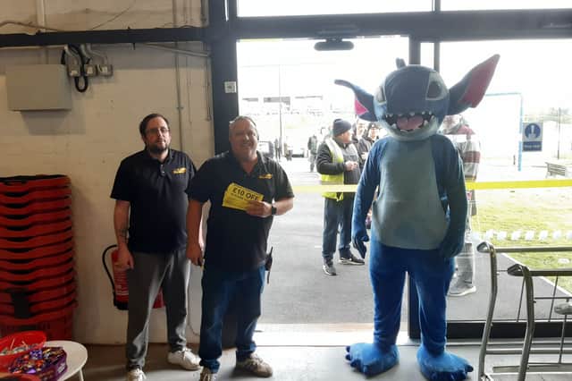 Owners Lee Taylor and Dean Kelly alongside Stitch at the opening of Washington's Bargain Clearance Centre.