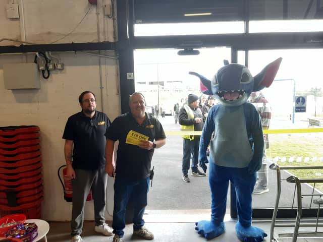 Owners Lee Taylor and Dean Kelly alongside Stitch at the opening of Washington's Bargain Clearance Centre.