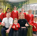Staff and children at Rickleton Primary School give a thumbs up to their latest Ofsted report.
