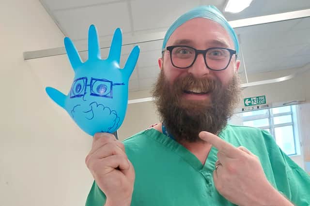 Anaesthetist Will Green helped keep five-year-old Peter Graham entertained ahead of his procedure at Sunderland Royal Hospital. Submitted picture.