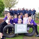 Hasting Hill Academy pupils and volunteers from AESC celebrate the opening of the school's new outdoor learning area.