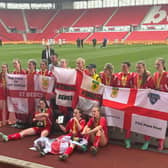The girls celebrate being crowned National Cup champions at the Bet365 Stadium.