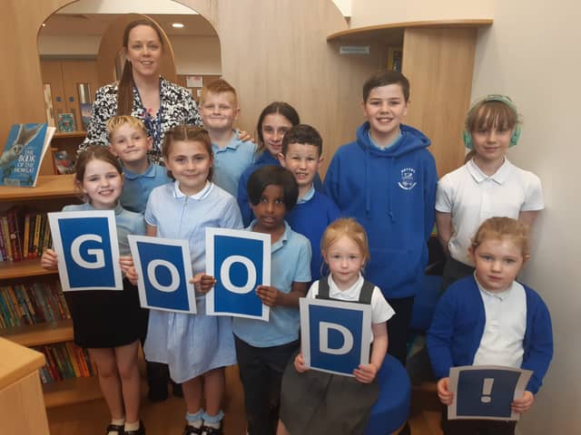 Headteacher Nicola Hill celebrates the school's good Ofsted report with children at the school.