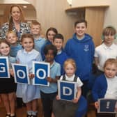 Headteacher Nicola Hill celebrates the school's good Ofsted report with children at the school.