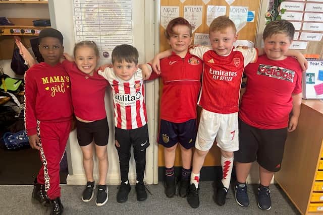 Children dressed in colour for the school's Wear Red Day.