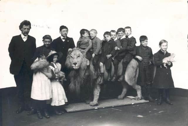 Wallace the Lion in 1913 with children from Sunderland Council Blind School.