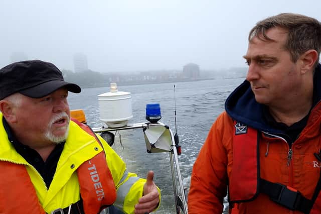 Reporter Neil Fatkin chatting to Peter Johnson about some of the situations he has experienced out on the river and in the harbour.