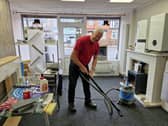 Kayleigh Fawcett's dad Roy Giles helps with the clear-up