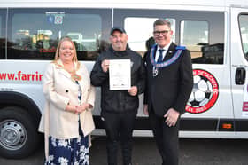 Mayor of Sunderland Cllr Allison Chisnall and Durham Freemasons' John Watts hand over the minibus to a club representative