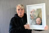 Anita with a picture of her parents