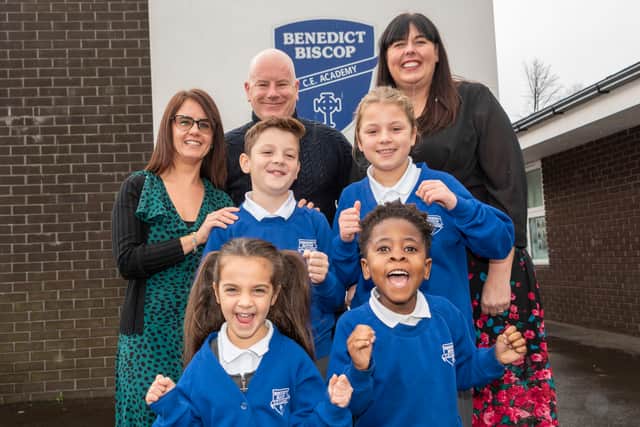 Headteacher Sarah Armstrong, governor Gordon Petrie, and deputy headteacher Gemma Clark celebrate the school's Ofsted report with pupils Myla, Avery, Reuben and Megan.