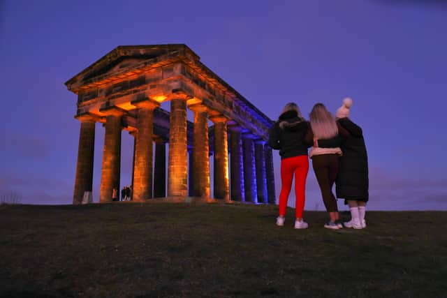 Penshaw Monument illuminated in the colours of the Ukraine national flag.