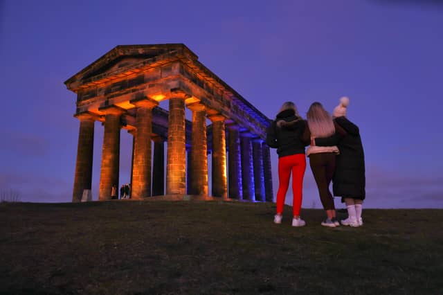 Penshaw Monument illuminated in the colours of the Ukraine national flag.