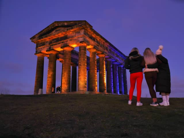 Penshaw Monument illuminated in the colours of the Ukraine national flag.