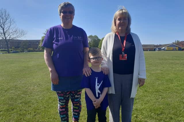 (Left to right) Relax Kids coach Margaret McManus, Theo, 5, and deputy headteacher Mrs Matthews.