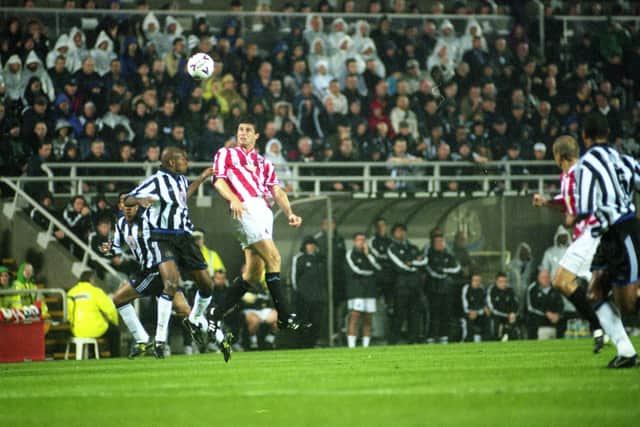 Niall Quinn wins a header for Sunderland.