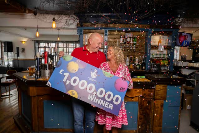 John and Lisa celebrate winning one million pounds on the national lottery. Picture by Anthony Devlin