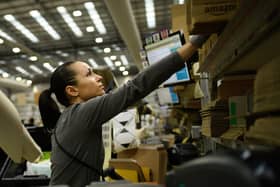 A member of staff packs items for delivery in an Amazon Fulfilment centre in Peterborough. Amazon has announced an above-inflation pay rise for tens of thousands of UK staff. (Photo: Leon Neal/Getty Images)