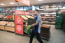 Colleagues at an Aldi store restock the shelves. The supermarket is recruiting 4,500 staff across the UK ahead of the busy Christmas period (Photo: Christopher Furlong/Getty Images)