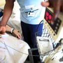 A nurse tends to recovering patients on a general ward at The Queen Elizabeth Hospital in Birmingham. Around 18,000 NHS staff in England are set to lose their jobs under major restructuring plans (Photo: Christopher Furlong/Getty Images)