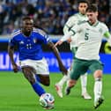 Moise Kean fights for the ball with Northern Ireland's defender Trai Hume. 