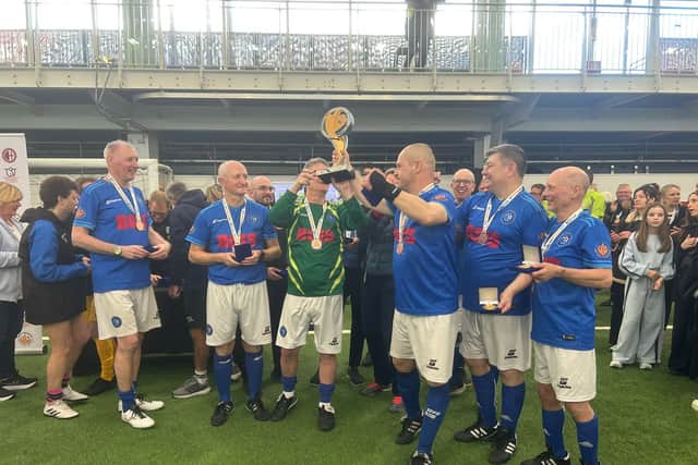 Parkies United lifting the trophy.