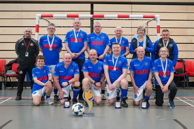 North East Parkies United with their medals and cup at the Beacon on Light.