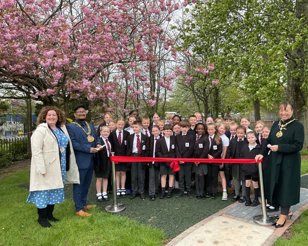 Northern Saints CofE Academy headteacher Rachel Heaney is joined by Sunderland Mayor, Cllr Ehthesham Haque, and Mayoress Cllr Lynda Scanlan to open the new playground.