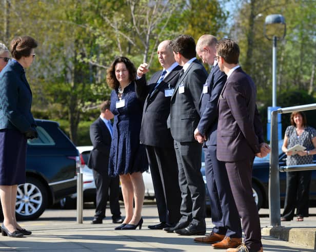 Princess Anne speaks with local officials outside the  National Glass Centre during her 2016 visit.