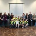 Staff and children at Grindon Infant School celebrate their OPAL Gold award.