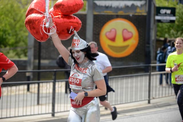 Alice Conlin from Red Sky running as the Tin Man in City Runs earlier this year