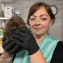 Hospital founder Claire Foster with Dodger the hedgehog.