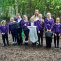 Teacher Courtney McCluskey working with children in the Forest School.