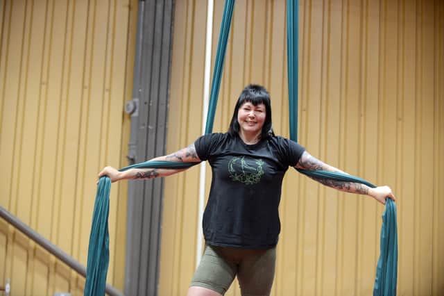 Emma up high using the silks