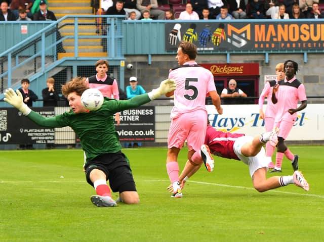 Sunderland U21s keeper Isaac Allan keeps out a header from South Shields forward Cedwyn Scott (photo Kevin Wilson)