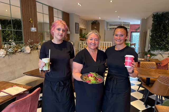 Blossoms owner Kaye Riley, centre, with staff members Jessica Smith, left, and Clair Lazaro, right.