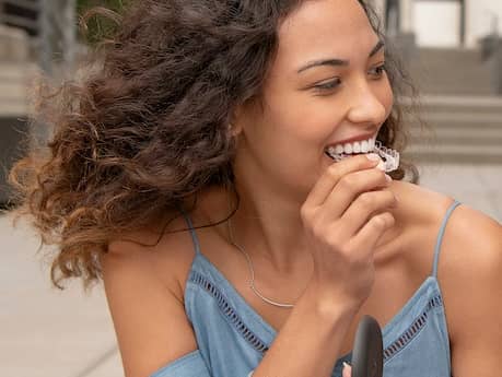 Invisalign aligners being attached.