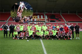 Members of the Fans Hub team taking part in a match at the Stadium of Light. (Inset) FA Cup winning captain Bobby Kerr will be taking part in the trip.