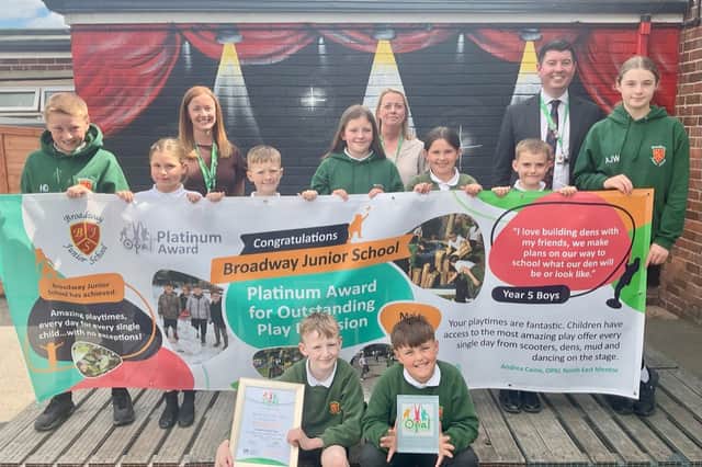 Broadway Juniors pupils and staff with their award