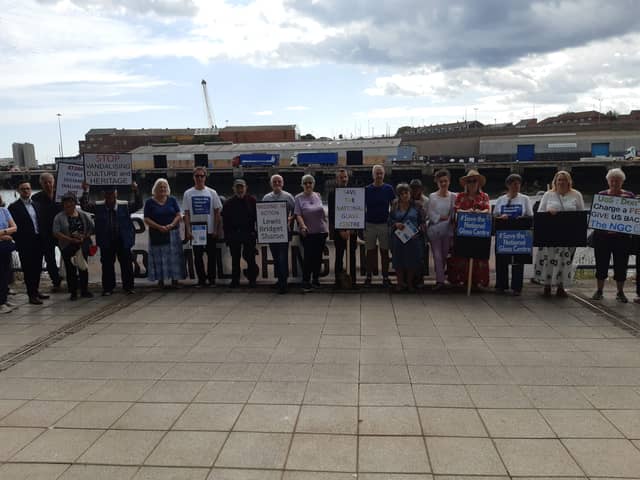 Campaigners gather outside of the National Glass Centre as it closed its doors to the public for the last time.