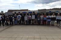 Campaigners gather outside of the National Glass Centre as it closed its doors to the public for the last time.