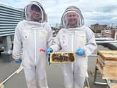 Gregory Boyle, Revenue Manager with the beehives on the roof at Hilton Garden Inn Sunderland with Gareth Freeman, GM