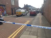 The police cordon on Cooperative Terrace as police officers carried out their investigations.