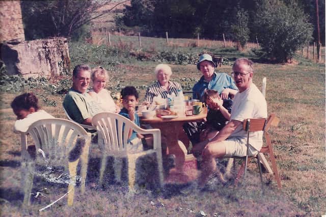 A family photo which was taken outside the French farmhouse which Steve bought with a friend.