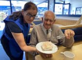 Billy Matthews enjoyed a slice of cake at Valentes Cafe in 2020, especially as it was served by his daughter Susan Dugan.