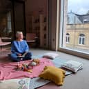 Alex Hughes in the living room space in Culture House where MotherFolk writing circles will be held